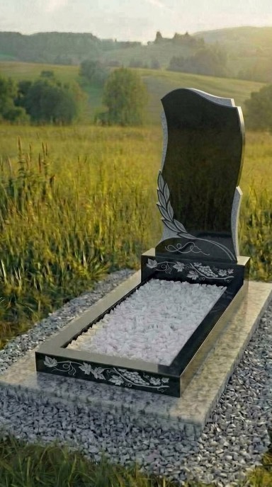 Фигурный чёрный памятник из габбро -диабаза с резной лавровой веткой, вертикальный памятник на кладбище