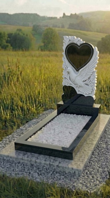Памятник в форме сердца с голубем из чёрного гранита, резной памятник из карельского габбро