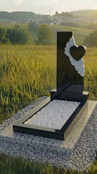 Памятник из чёрного гранита с сердцем, резной женский памятник из карельского габбро