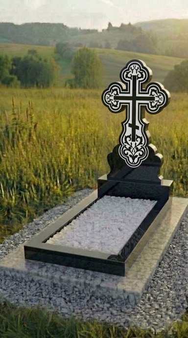 Гранитный памятник с ажурным резным крестом из чёрного гранита габбро